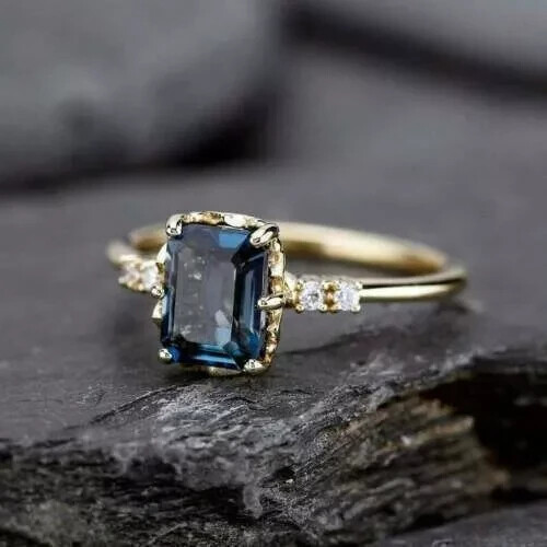 2Ct Emerald-Cut Blue Topaz Engagement Ring in 14k Yellow Gold Plating for Women