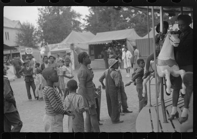 Photo:1930s Black Children Fair Carousel Ride Festival Photo