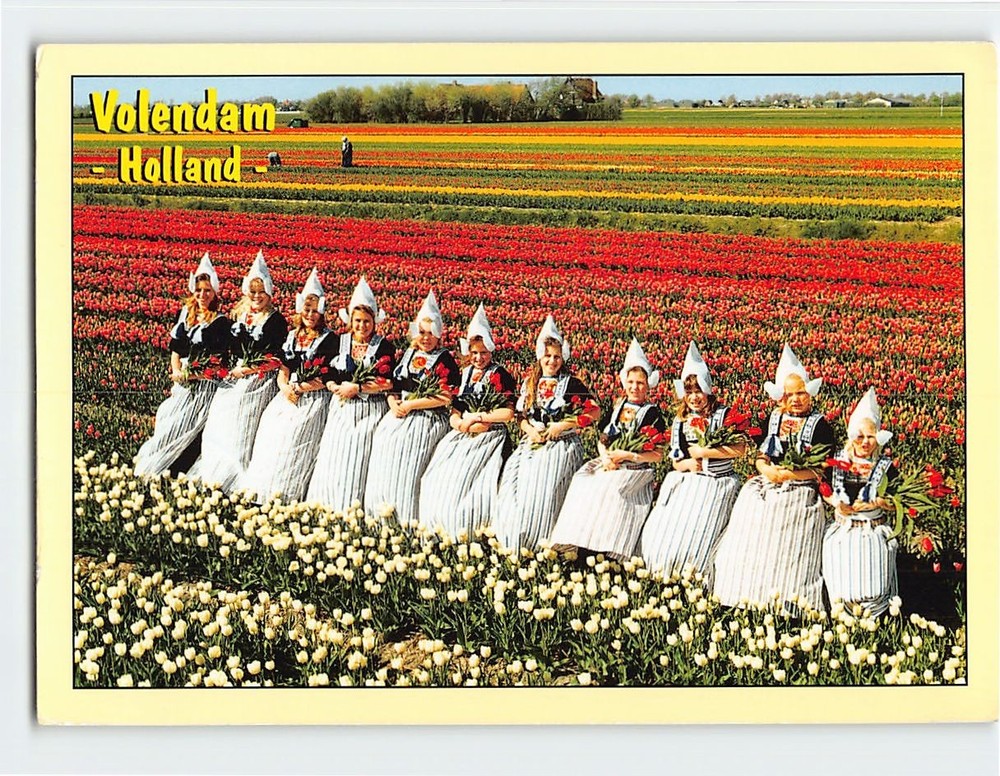 Postcard Girls in Dutch Attire in Tulip Fields Volendam Holland Netherlands