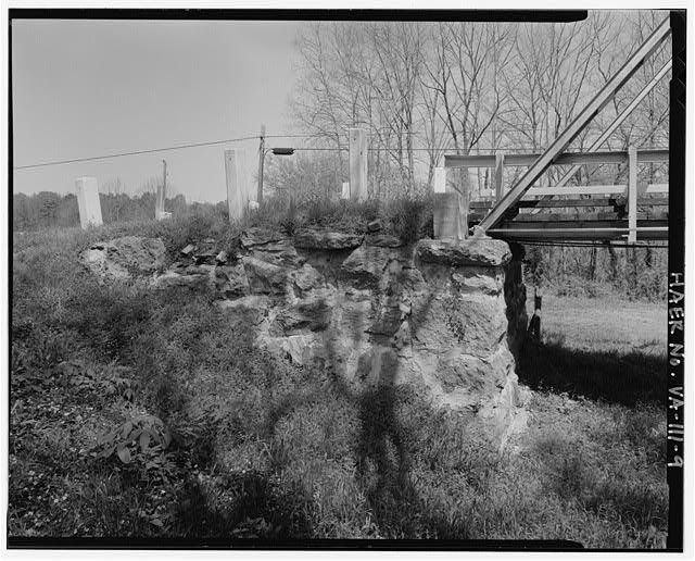 9. NORTH ABUTMENT, LOOKING EAST - Gholson Bridge, Spanning Meherrin River VA