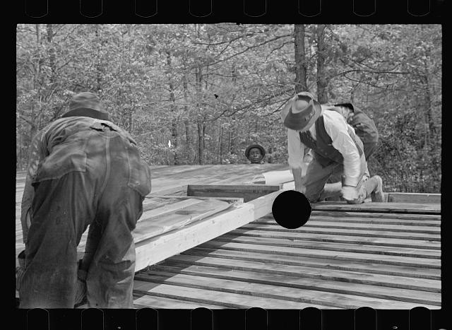Photo:Roanoke Farms North Carolina 1938 Unloading Prefabricated House Wall