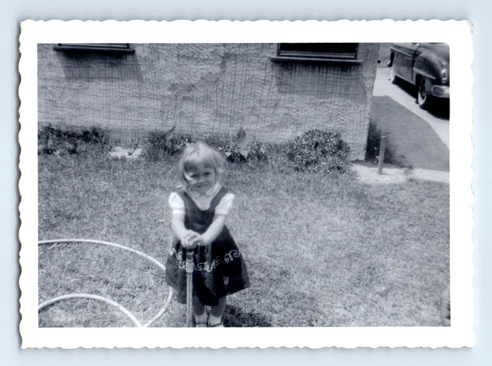 Old Vintage Photo SOLO CUTE SMILING GIRL IN YARD BY GARDEN HOSE SNAPSHOT