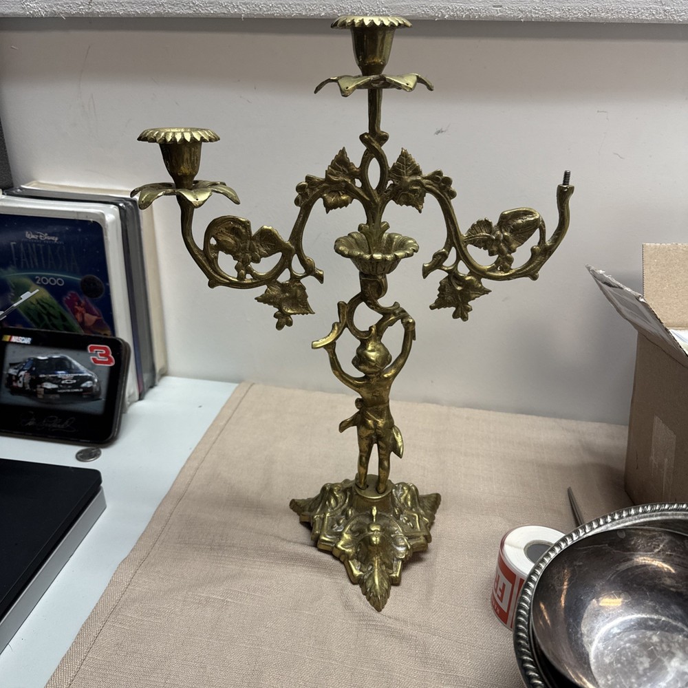 Antique brass cherub candelabra With leafy pedestal base ornate floral branches