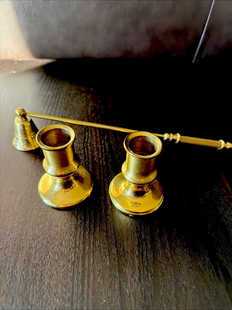 Set Of Brass Candle Holders And A Brass Candle Snuffer.
