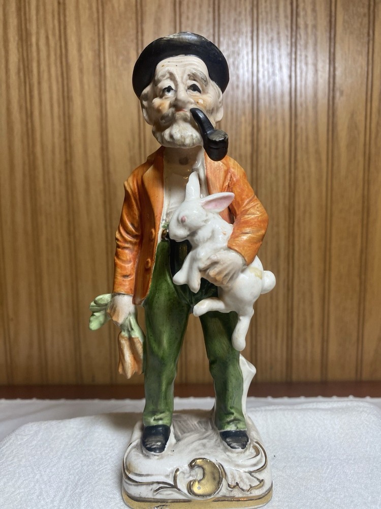 Ceramic Hand-Painted Man Holding Rabbit Figurine, Multicolor Glossy, 7 in