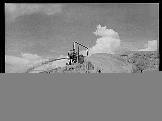 Freeport Sulphur Company, Grand Ecaille, Louisiana. Melted sulphur pouring into
