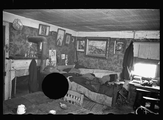 Photo:1930s Interior Cabin Room Wood Stove Bed Desk Portraits