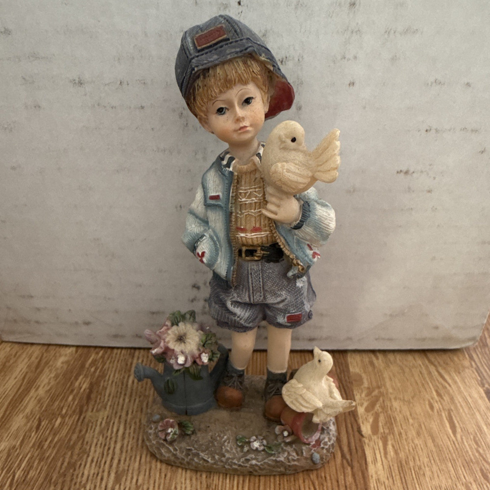 Boy with Birds Resin Figurine Multicolor Painted Children Animals