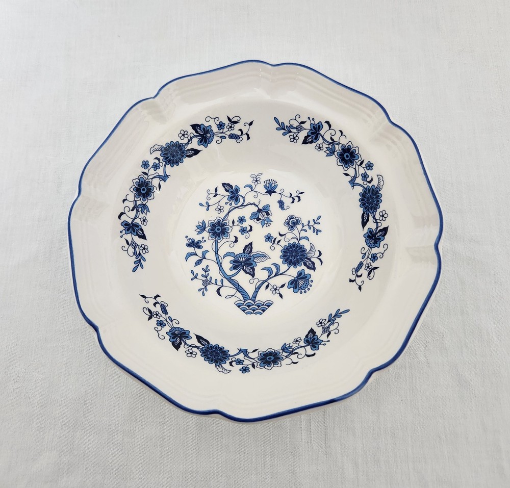 Blue and white floral design ceramic round serving bowl; three cup capacity.