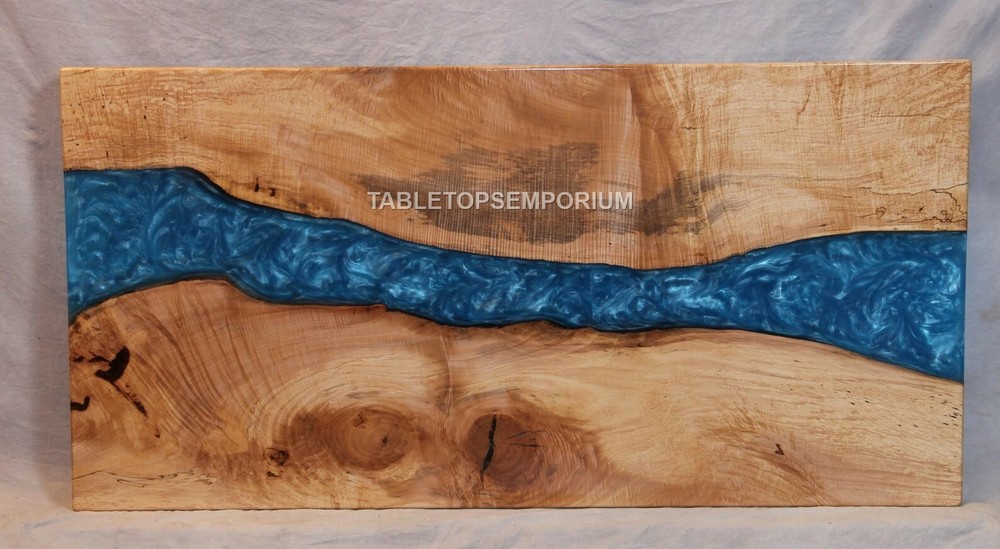 Epoxy resin coffee table with acacia wood decor