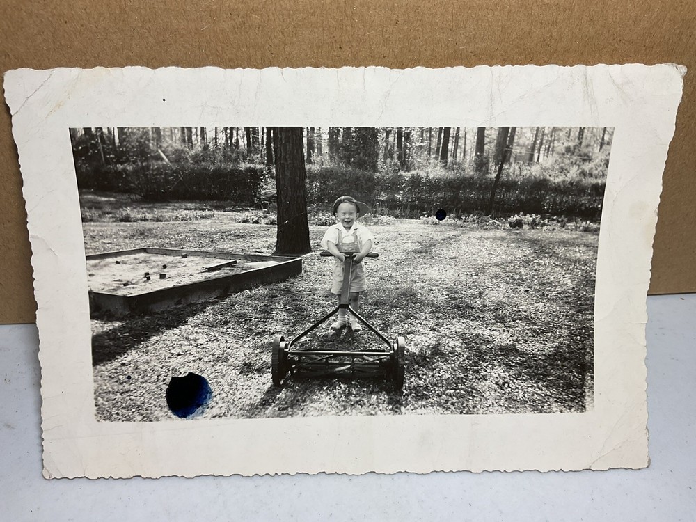 25 Mar 1945 Photograph Young Boy Pushing Lawn Mower Hat Sandbox S1324