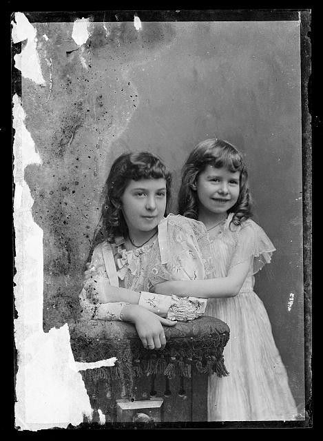 Photo:Vintage Portrait of Two Young Girls in Dresses