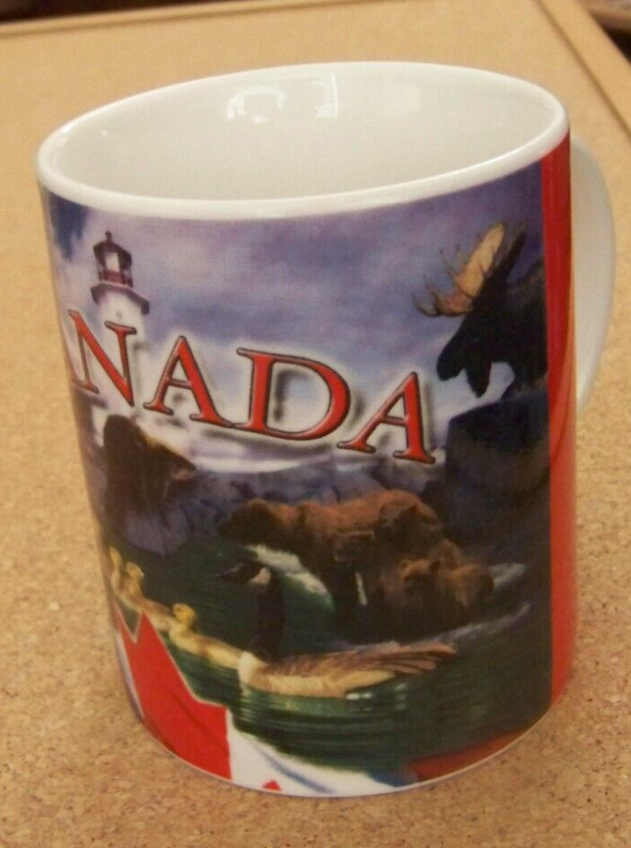 Canada coffee mug cup feature coastline lighthouse polar bear moose geese beaver
