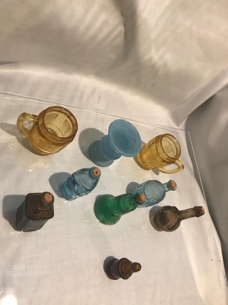 mix of minuture bottles beer mugs,1 fish,1 liberty bell,1 vase and 4 different