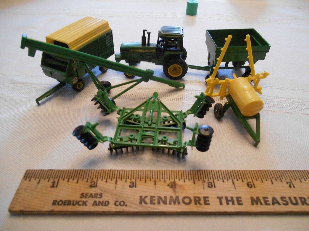 Small scale ERTL John  Deere Tractor with 5 implements