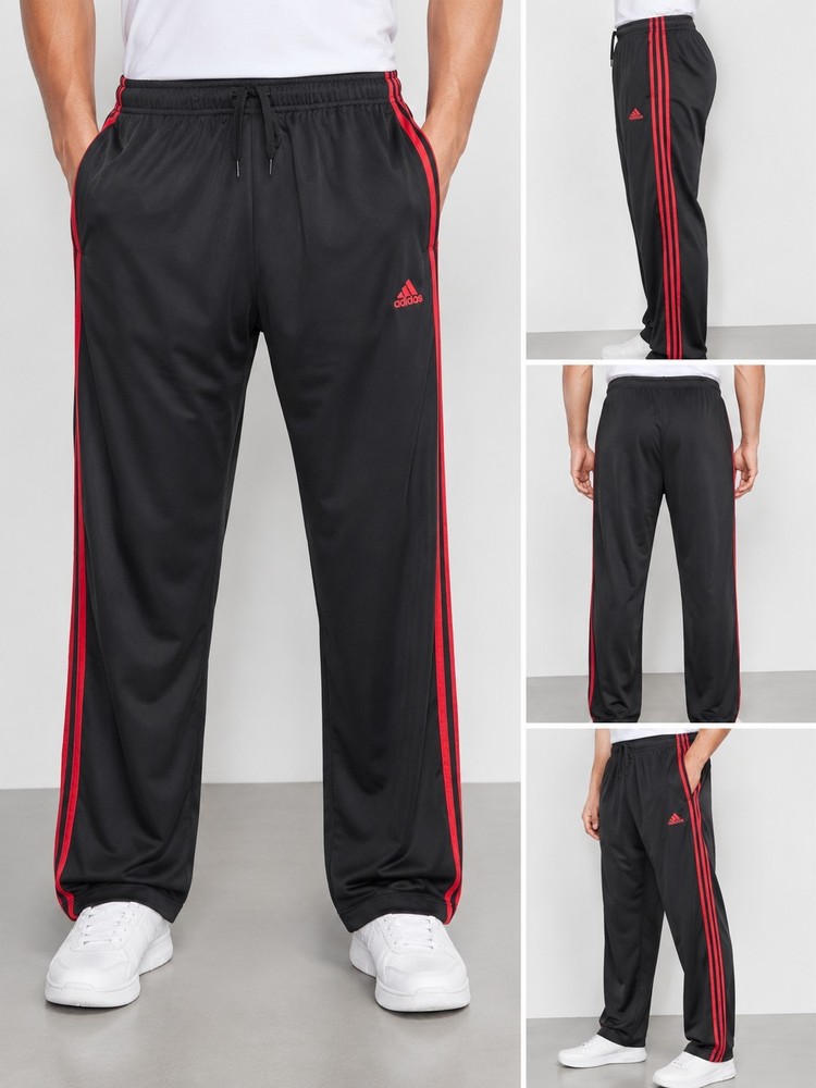 Adidas Primegreen men's track pants in size XL. Black with bold red side stripes