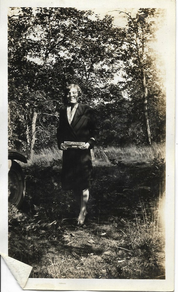 Abstract Antique Photo of Woman in Forest Holding Ward's Finest Donuts Box-image