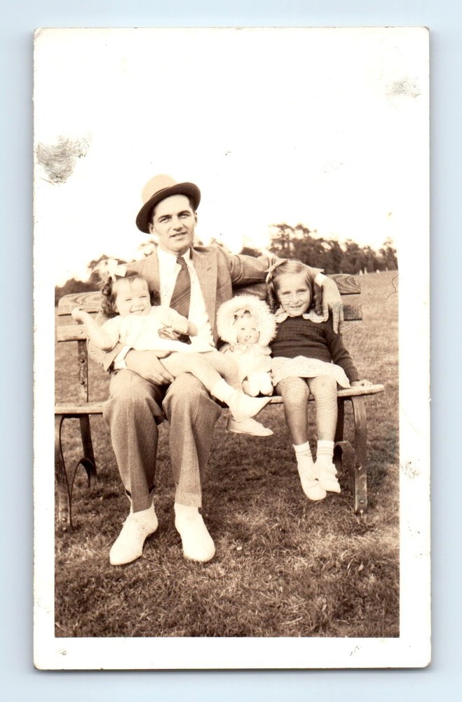 Old Vintage Photo MAN AND GIRLS SITTING ON PARK BENCH TOY DOLL SNAPSHOT