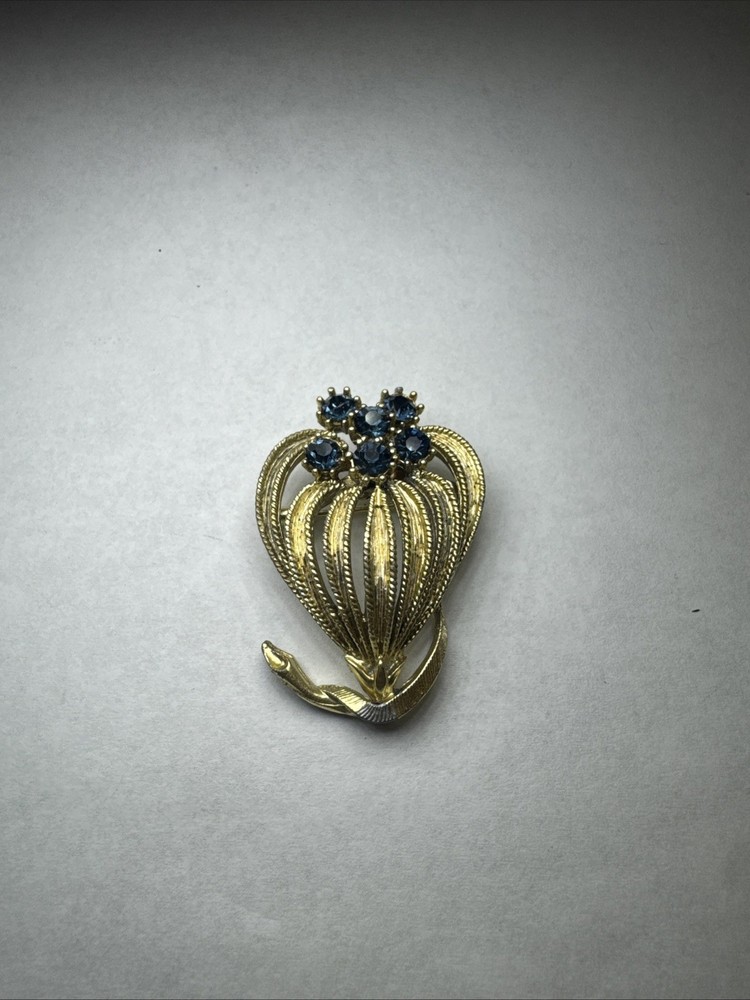 Vintage Blue Rhinestone Textured Gold Tone Blooming Flower Brooch