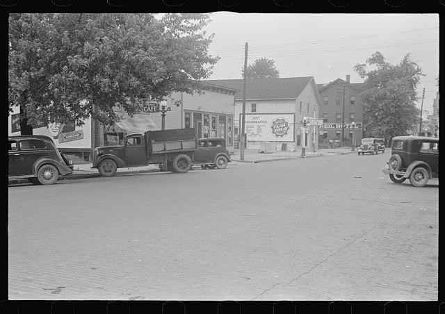 Photo:London Ohio 1938 Main Street trucks cafe storefronts