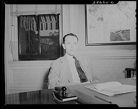 Photo:Man at Desk Office Interior 1930s Map on Wall
