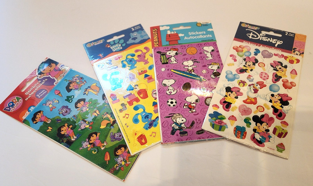 4 sealed lot vtg stickers Peanuts Snoopy Dora Disney Blue's Clues Sandylion