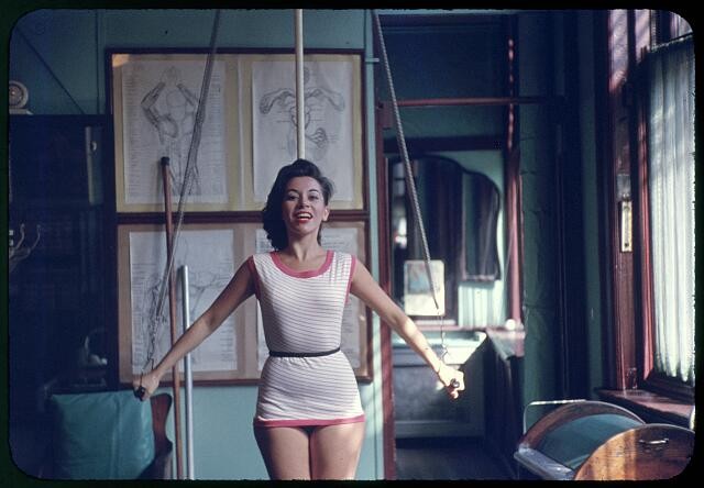 Photo:Elaine Malbin 1956 Woman Exercising on Gym Equipment Training Room