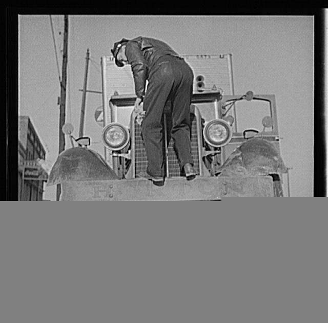 Melvin Cash Truck Driver 1940s Putting Water in Radiator Truck Front View
