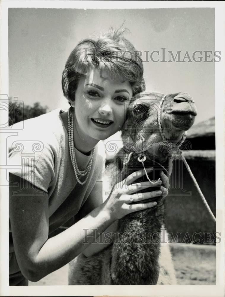1958 Press Photo Actress Sylva Koscina Poses with Camel at Zoo, Rome - kfx05379
