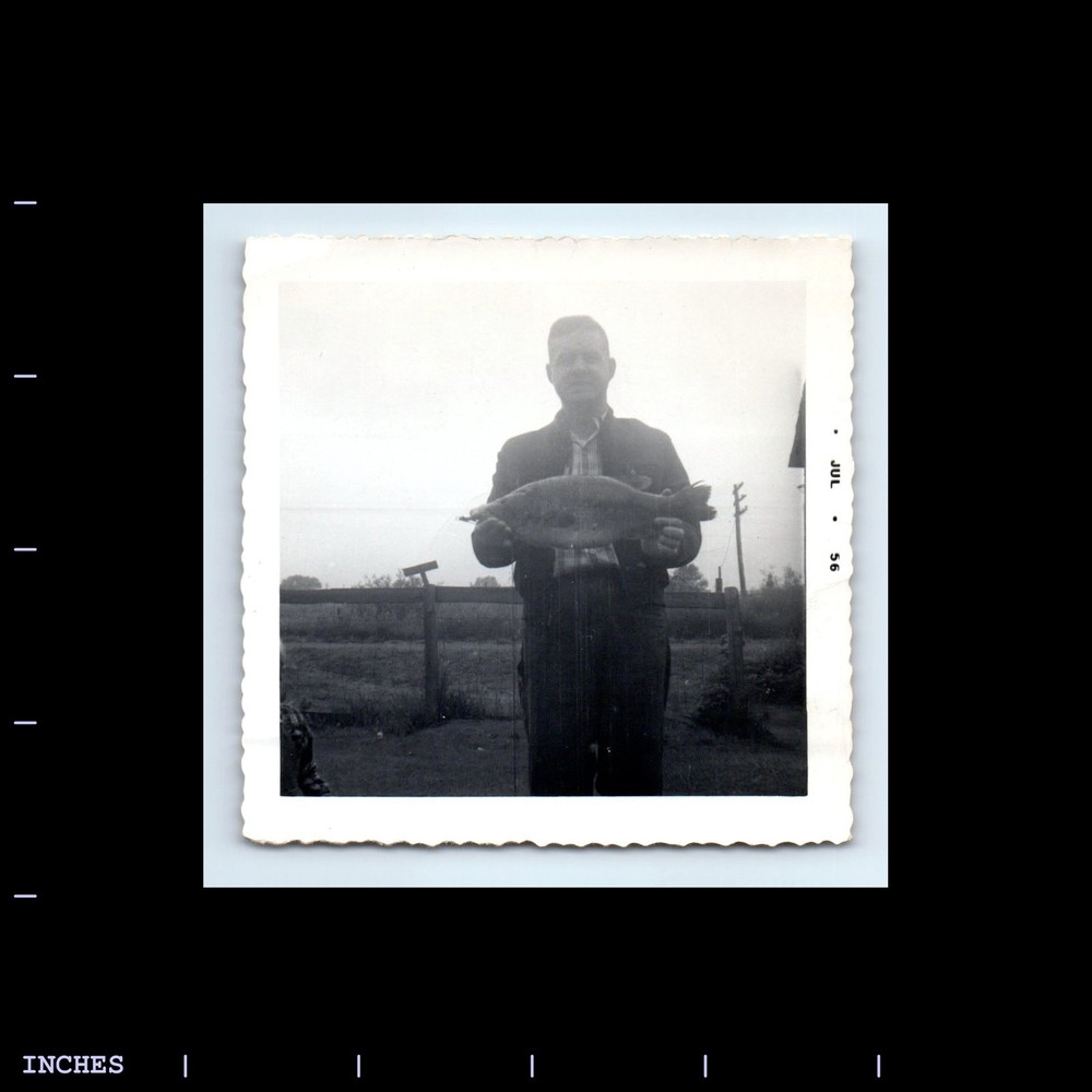 Old Square Photo MAN HOLDING FISH CAUGHT FISHING 1956