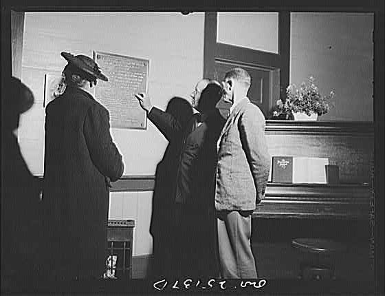 Photo:1910s Men and Woman Reading Plaque Interior Office Scene