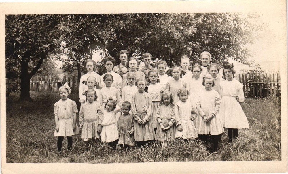 Vintage Postcard RPPC- A large family standing in a yard 1900s