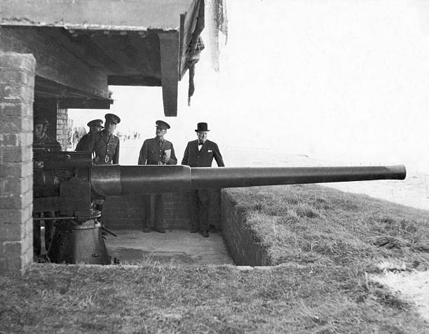 British Prime minister Winston Churchill inspecting a coastal gun - Old Photo