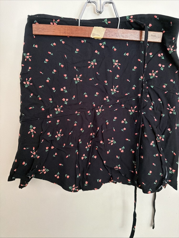 Urban Outfitters women’s size small floral wrap around skirt.  Black