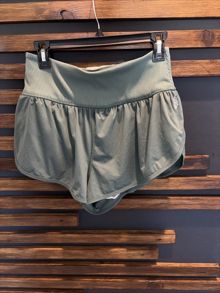 Free People Movement High-Rise Running Shorts in a sage green color Size Large