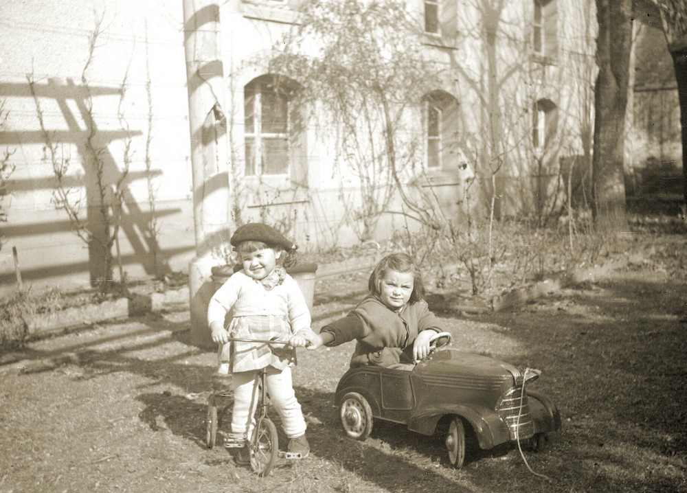 Little girls playing bike & pedal car - Vintage photo reproduction print