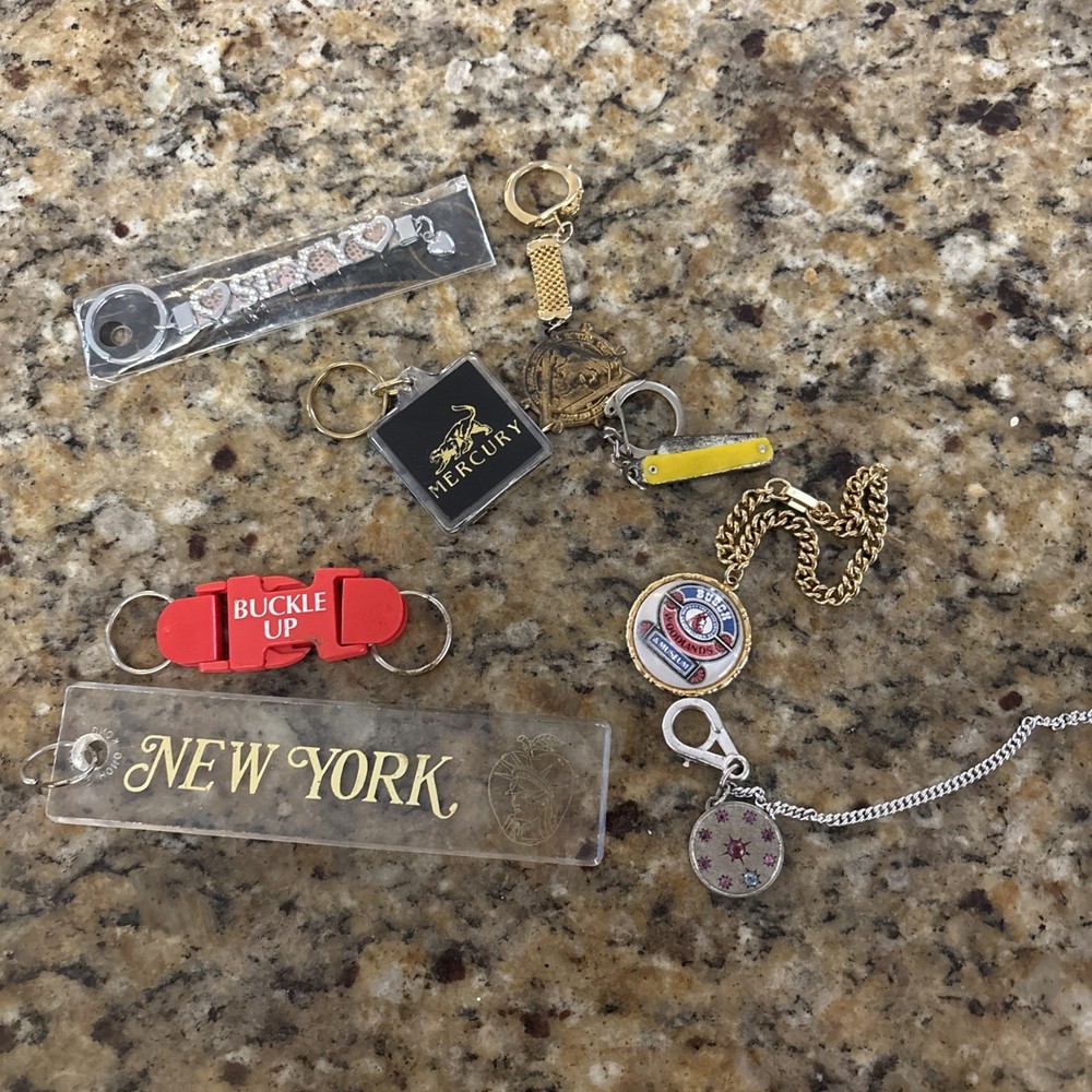 Lot of 8 assorted vintage key chains.
