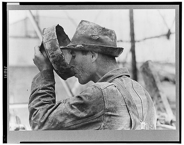 Photo:Oil field worker drinking water, Kilgore, Texas