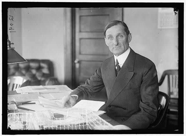 Photo:McADOO, 1913-1921. AT DESK, WILLIAM GIBBS. SECRETARY OF THE TREASURY