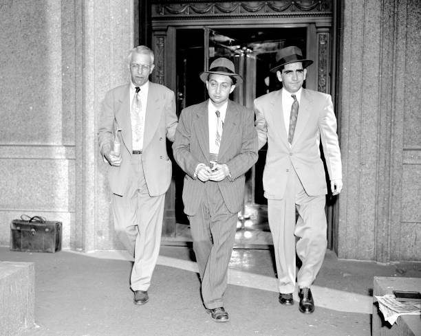 With a deputy marshal on either side Harry Gold leaves Federal Cou .. Old Photo