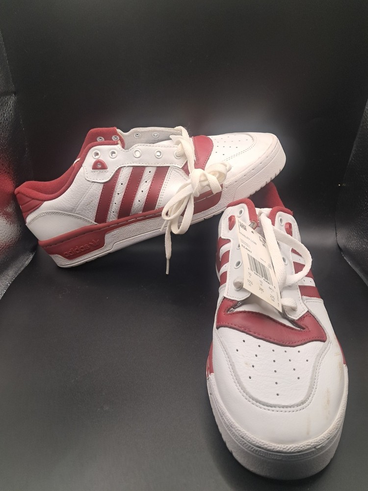 Adidas Originals Rivalry Low shoes in white and red.