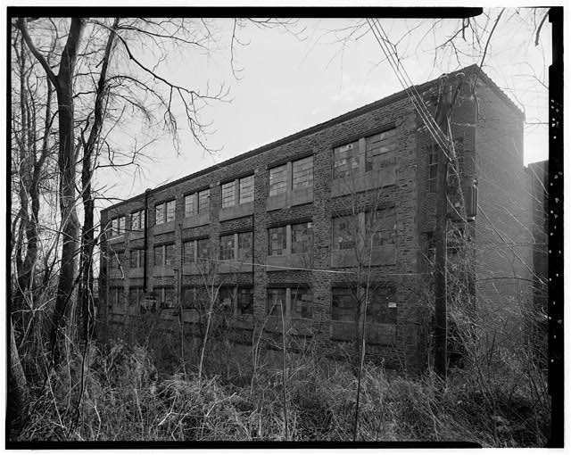 2. Building 18 north elevation oblique. View looking south. - John & James