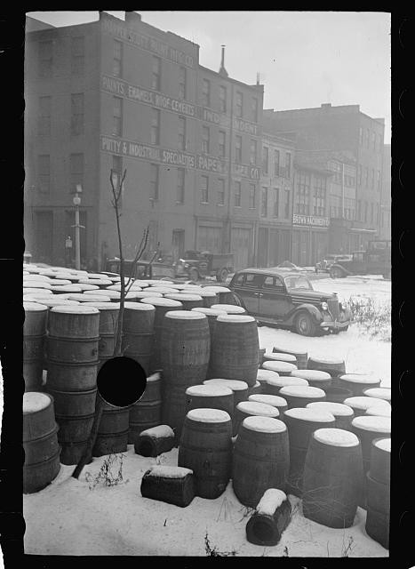 Photo:Industrial District Snow Cars Barrels 1930s City Street Scene