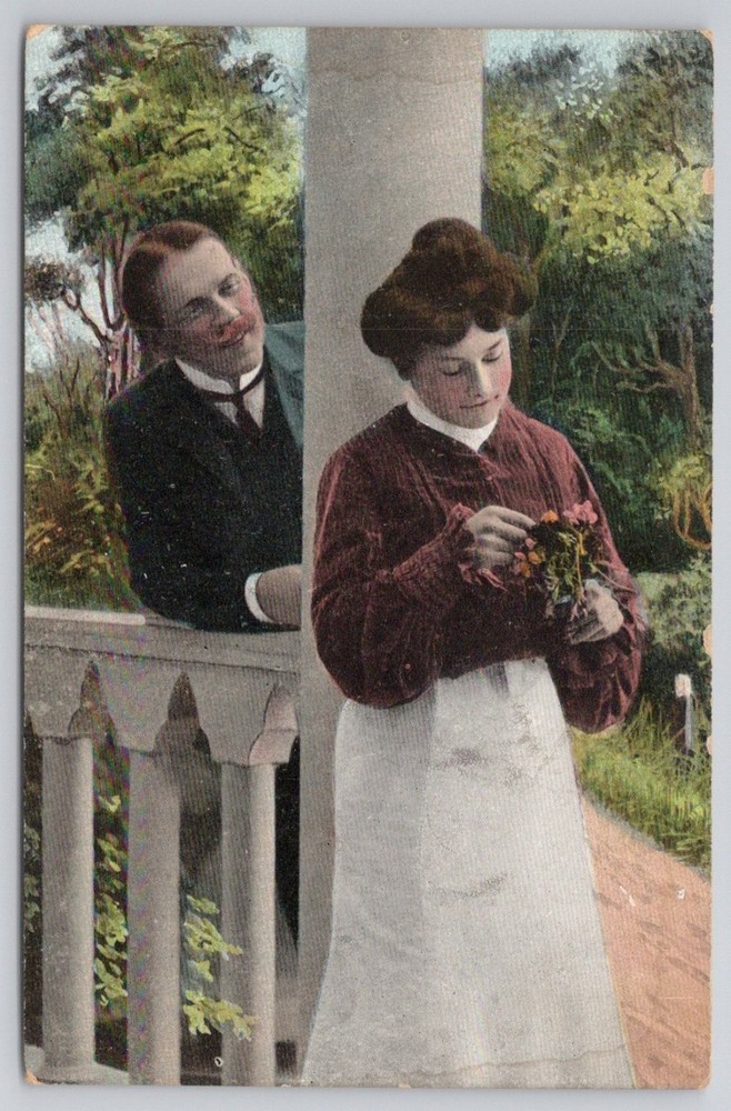 Edwardian Romance Postcard Man Peeking Woman Flowers Th.E.L. Bachmansville PA