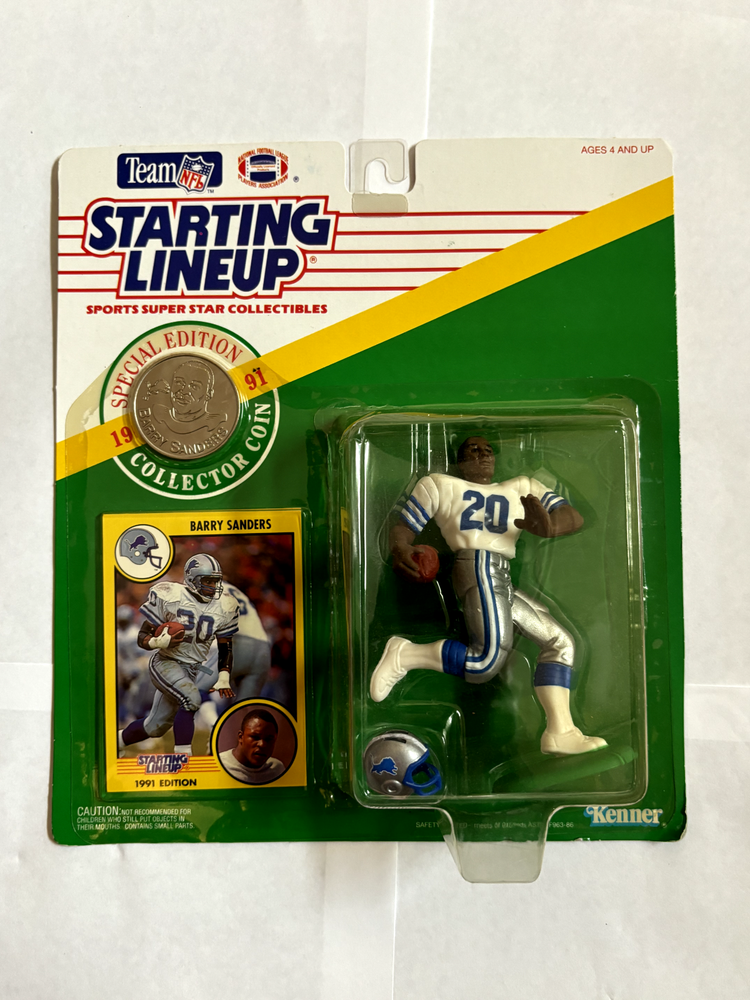 BARRY SANDERS 1991 STARTING LINEUP  W/ COIN AND CARD (NIP*; S*; M*; P*; NSE*)