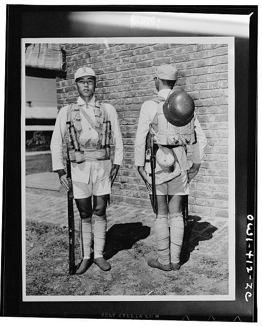 Japanese American Soldiers 1940s Military Uniforms Rifles Helmets Backs View