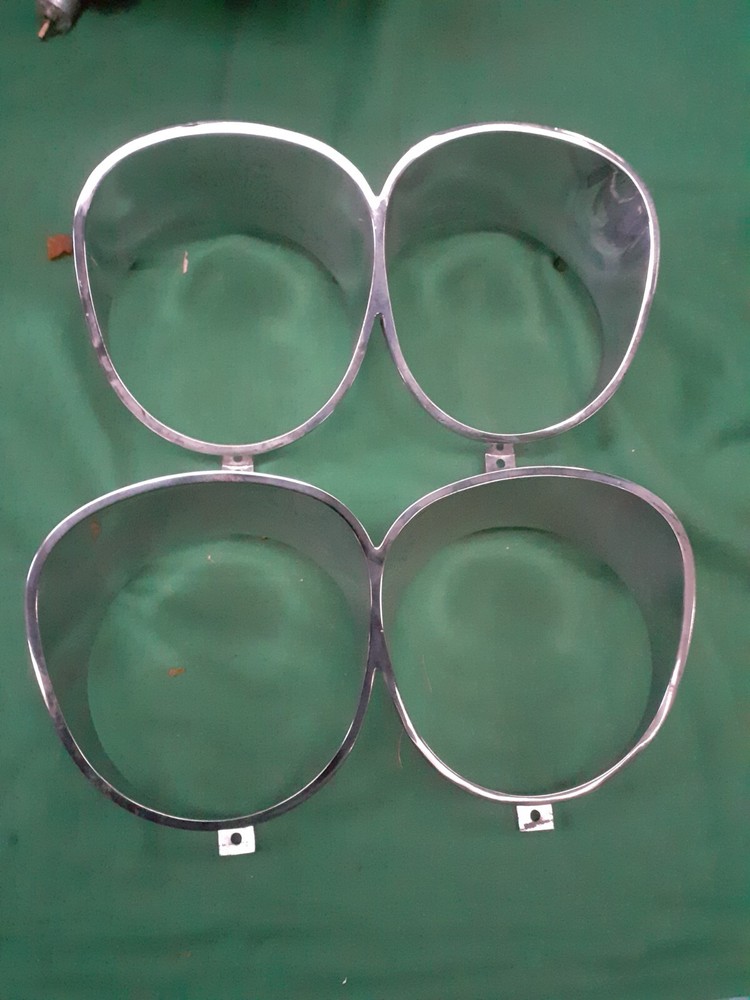 Fiat 130 sedan pair of headlight frames NEW