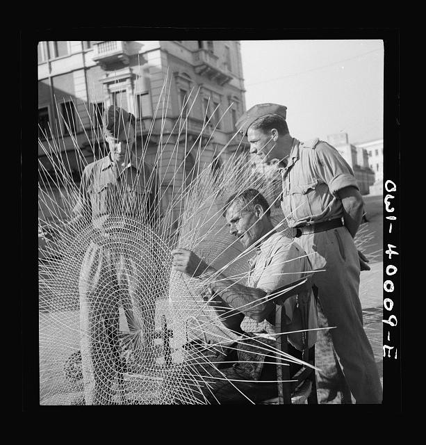 Photo:Sicily Italy 1943 British Soldiers Watch Man Weaving Fish Nets