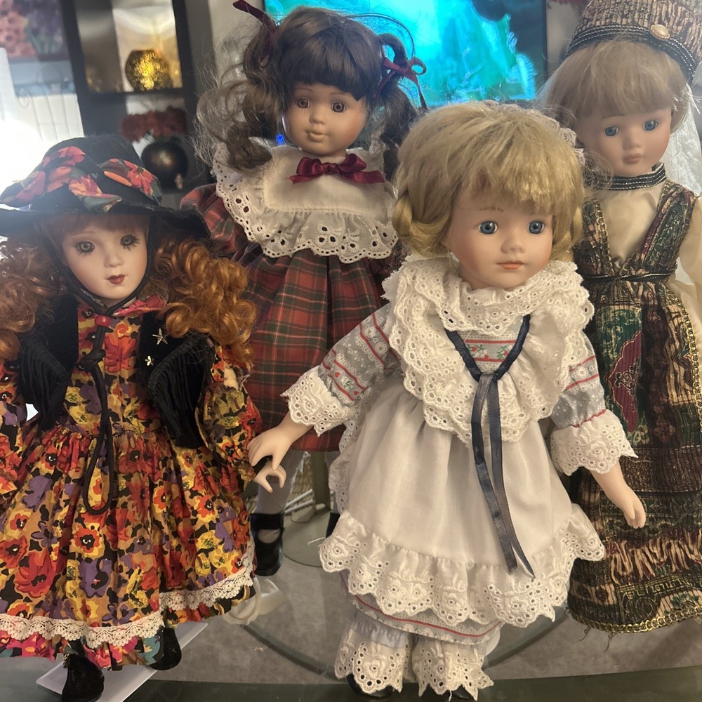 porcelain dolls collectible. 4 Dolls With Stands