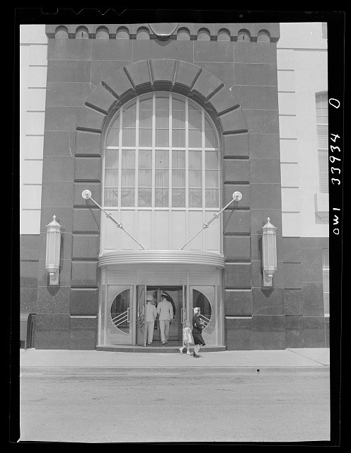 Photo:1930s Art Deco Building Entrance People at Rotating Door